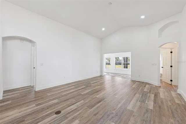 a view of kitchen with wooden floor and electronic appliances