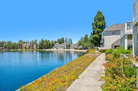 a view of a lake with a house in the background