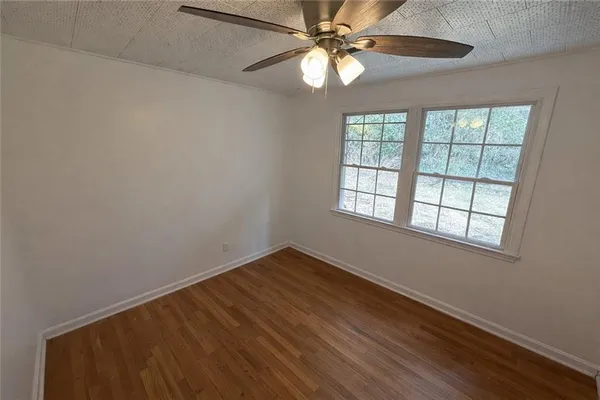 a bathroom with a sink toilet and a mirror