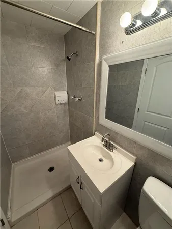 a kitchen with a refrigerator sink and cabinets