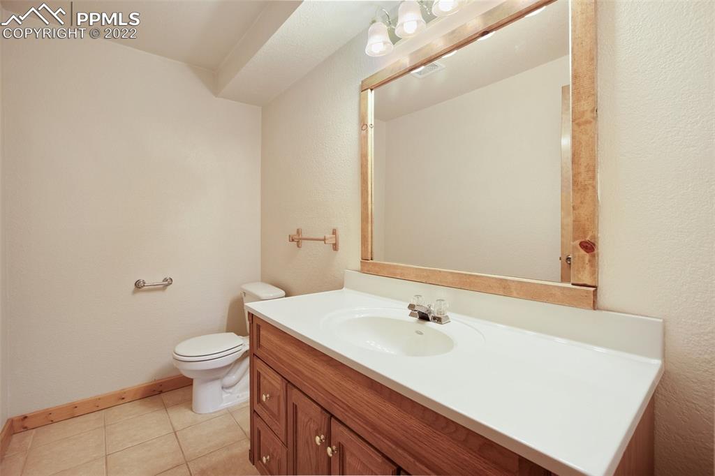 883 Rocky Mountain View Divide, CO 80814 - Photo 18 of 35 a bathroom with a sink and a toilet