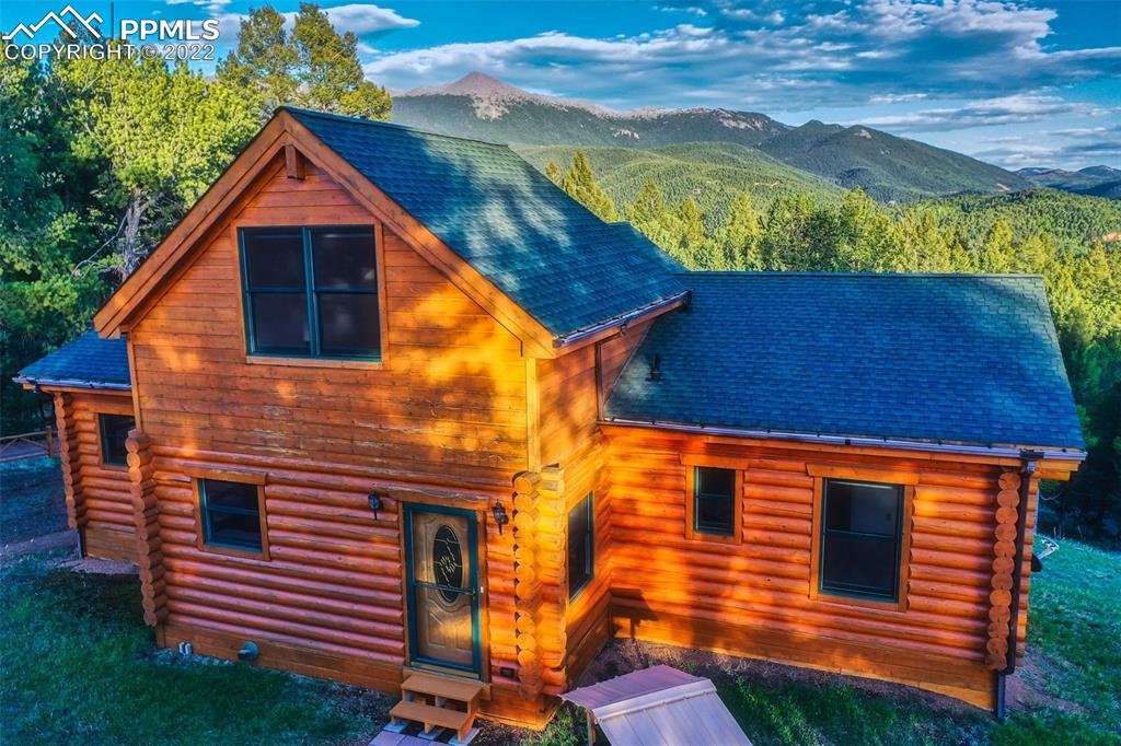 883 Rocky Mountain View Divide, CO 80814 - Photo 26 of 35 a backyard of a house with a yard and outdoor seating