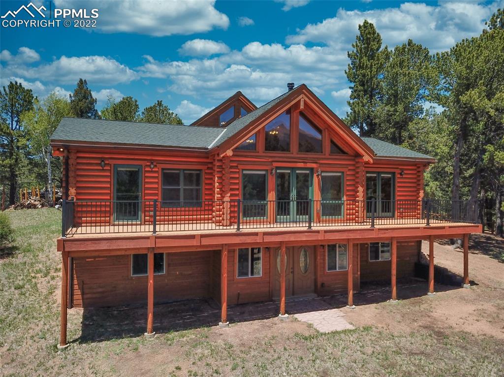 883 Rocky Mountain View Divide, CO 80814 - Photo 28 of 35 a front view of a house with a garden