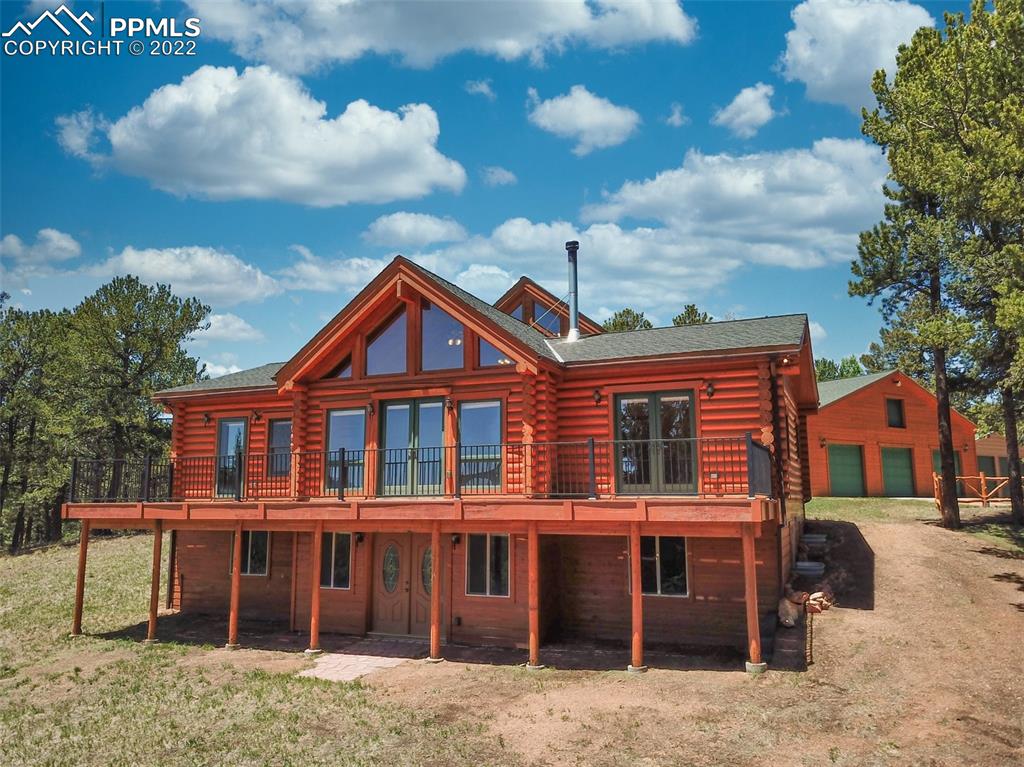 883 Rocky Mountain View Divide, CO 80814 - Photo 29 of 35 a front view of a house with a yard