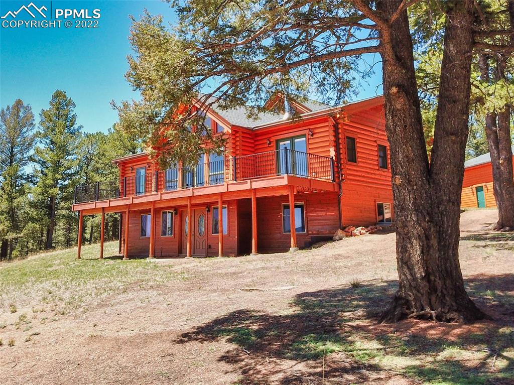 883 Rocky Mountain View Divide, CO 80814 - Photo 31 of 35 a front view of a house with a yard