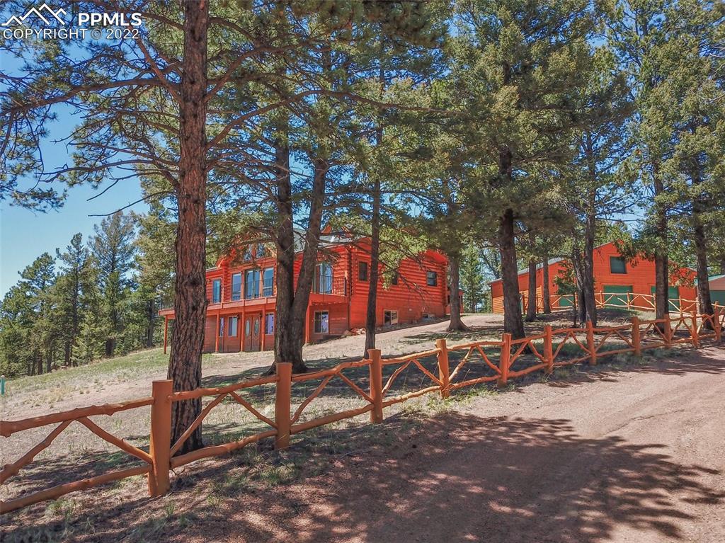883 Rocky Mountain View Divide, CO 80814 - Photo 32 of 35 a view of outdoor space with seating area and trees