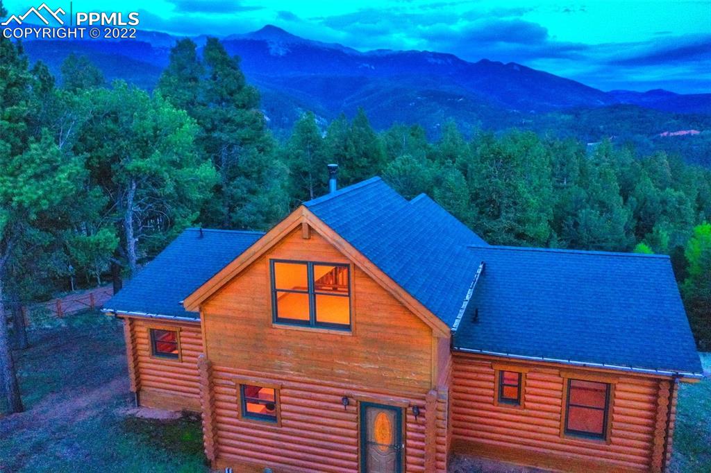 883 Rocky Mountain View Divide, CO 80814 - Photo 33 of 35 a backyard of a house with a tree