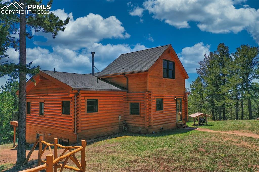 883 Rocky Mountain View Divide, CO 80814 - Photo 4 of 35 a view of a house with a yard