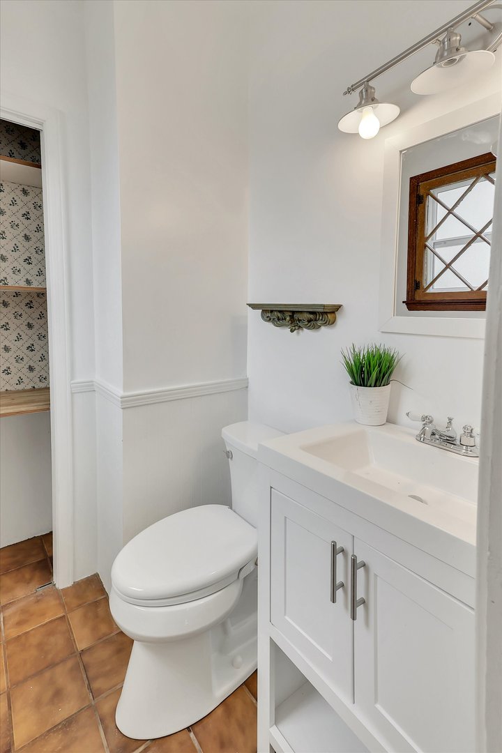 4038 Grove Avenue Brookfield, IL 60513 - Photo 12 of 45 a bathroom with a sink and a mirror