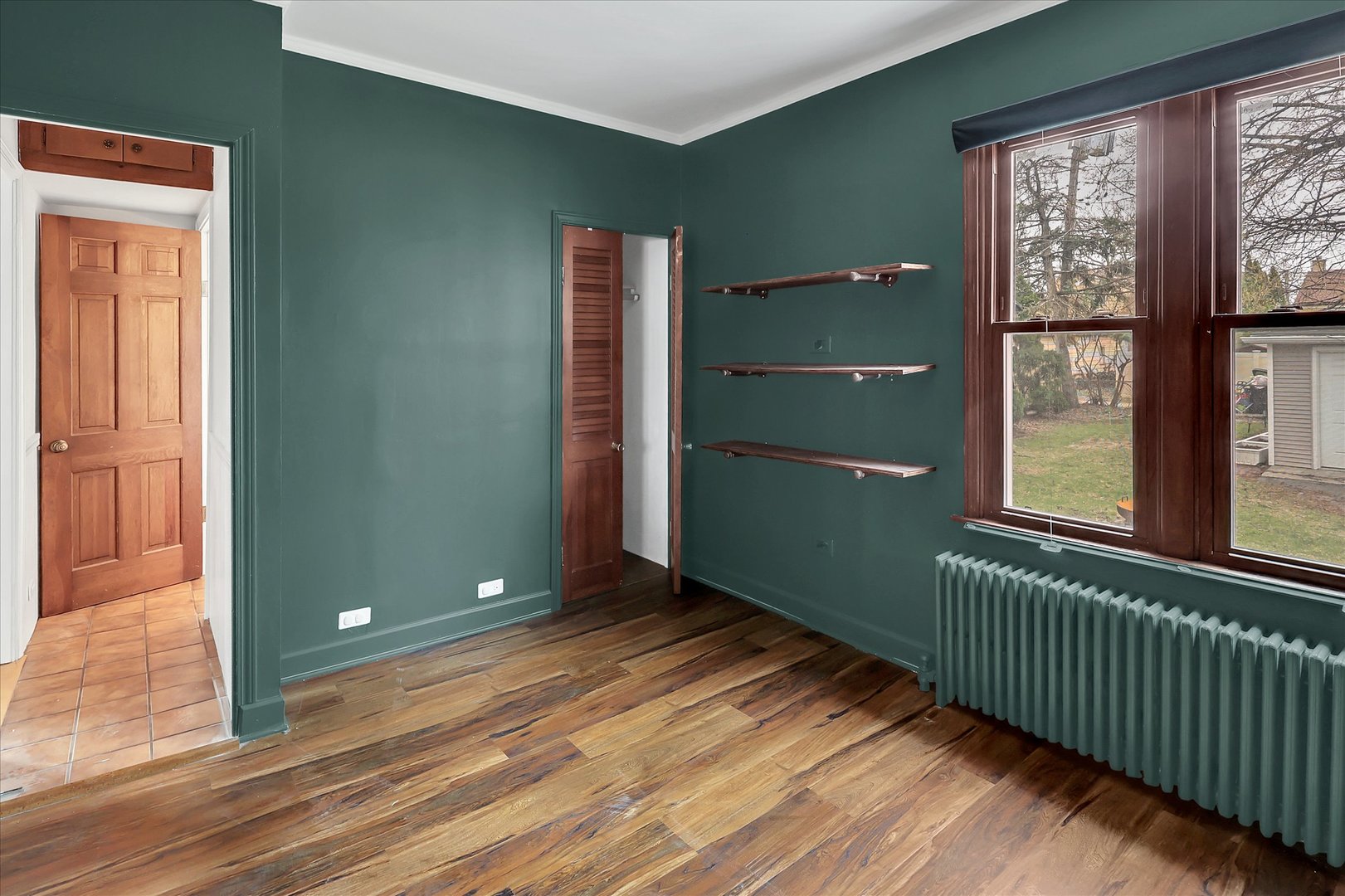 4038 Grove Avenue Brookfield, IL 60513 - Photo 15 of 45 a view of a room that has a large window and wooden floor
