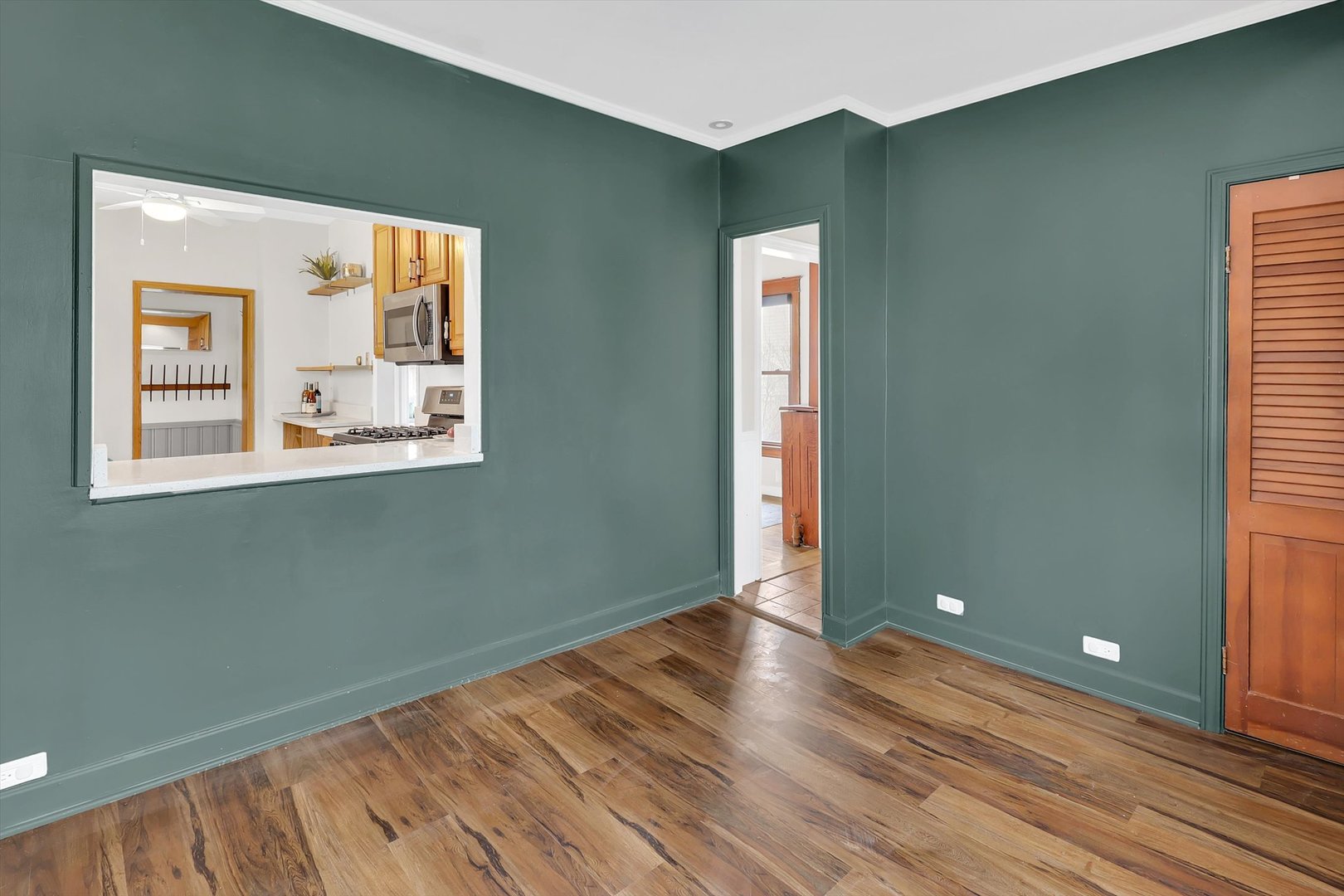 4038 Grove Avenue Brookfield, IL 60513 - Photo 17 of 45 a view of a room with wooden floor and windows