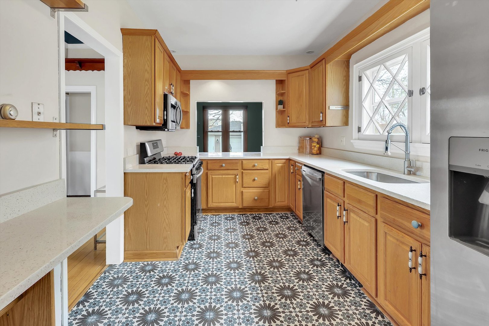 4038 Grove Avenue Brookfield, IL 60513 - Photo 20 of 45 a kitchen with sink cabinets and window
