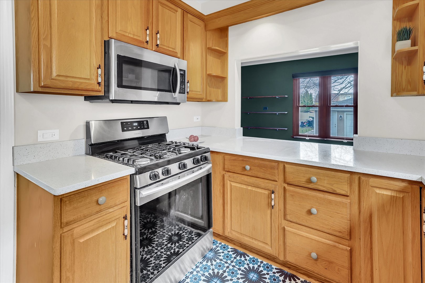 4038 Grove Avenue Brookfield, IL 60513 - Photo 22 of 45 a kitchen with granite countertop cabinets stainless steel appliances and a counter space