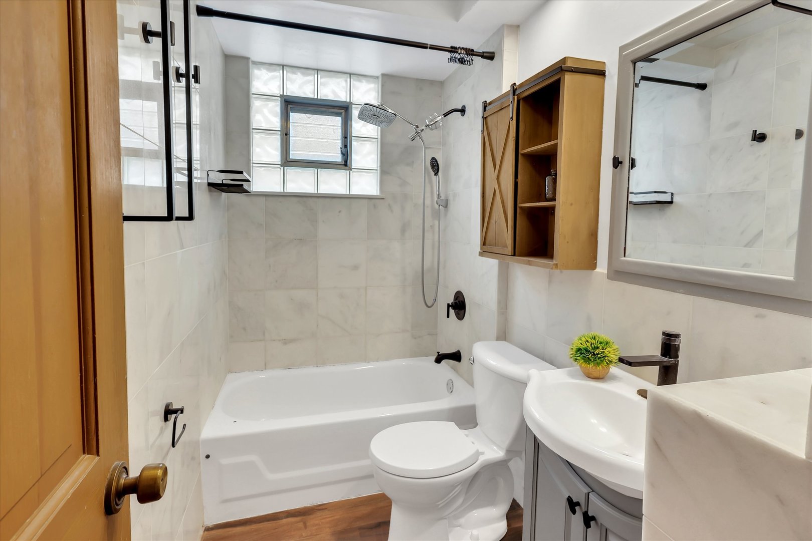 4038 Grove Avenue Brookfield, IL 60513 - Photo 28 of 45 a bathroom with a sink toilet and shower