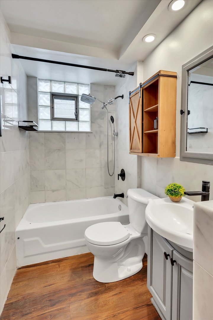 4038 Grove Avenue Brookfield, IL 60513 - Photo 29 of 45 a bathroom with a sink toilet and shower