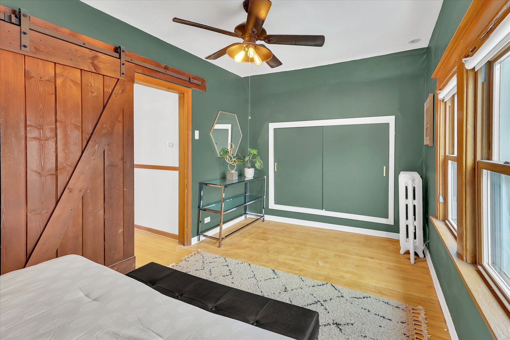 4038 Grove Avenue Brookfield, IL 60513 - Photo 32 of 45 a bedroom with a bed and a chandelier