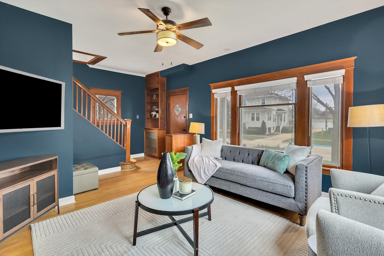 4038 Grove Avenue Brookfield, IL 60513 - Photo 4 of 45 a living room with furniture a flat screen tv and a large window