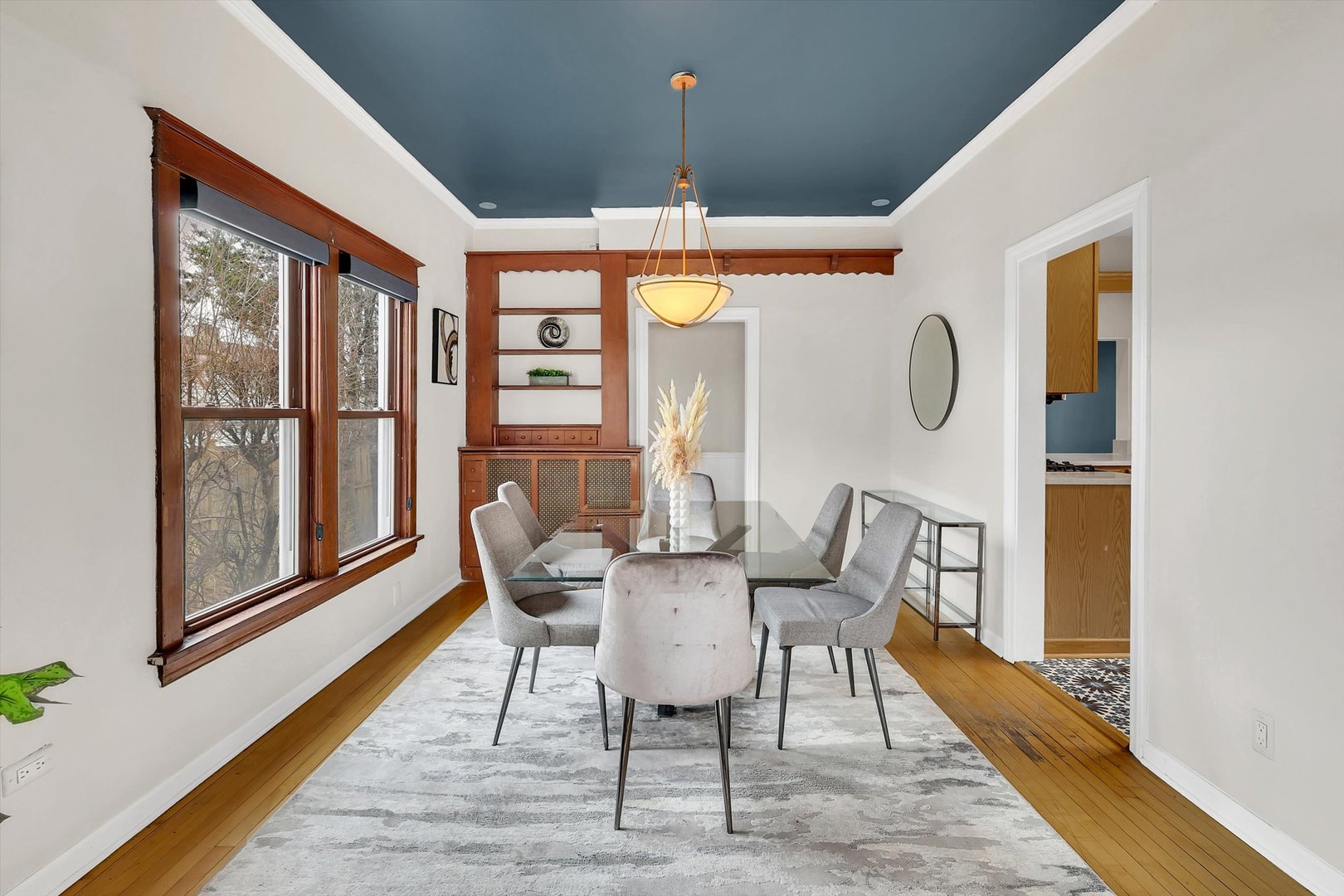 4038 Grove Avenue Brookfield, IL 60513 - Photo 8 of 45 a dining room with furniture a chandelier and wooden floor