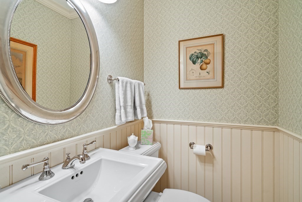 135 Washington Street Wellesley, MA 02481 - Photo 15 of 39 a bathroom with a sink and a mirror