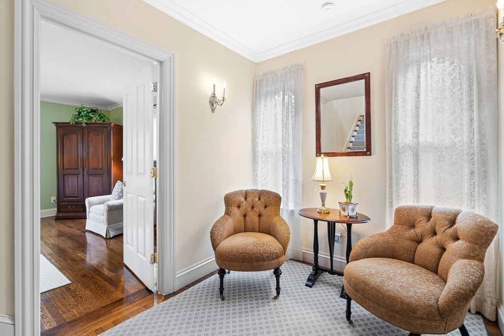 135 Washington Street Wellesley, MA 02481 - Photo 16 of 39 a living room with furniture and a window