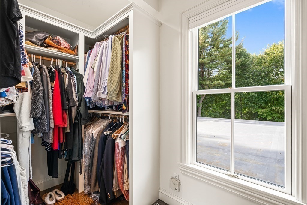 135 Washington Street Wellesley, MA 02481 - Photo 19 of 39 a view of walk in closet with clothes and shoes