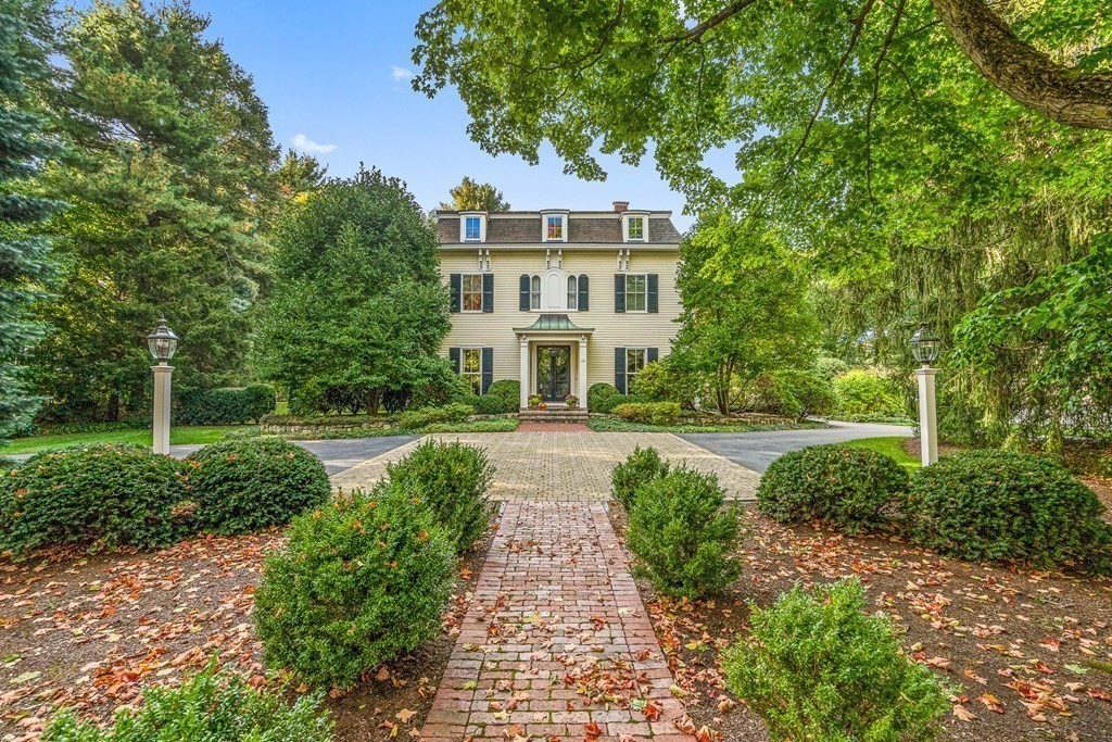 135 Washington Street Wellesley, MA 02481 - Photo 2 of 39 a front view of a house with yard and green space