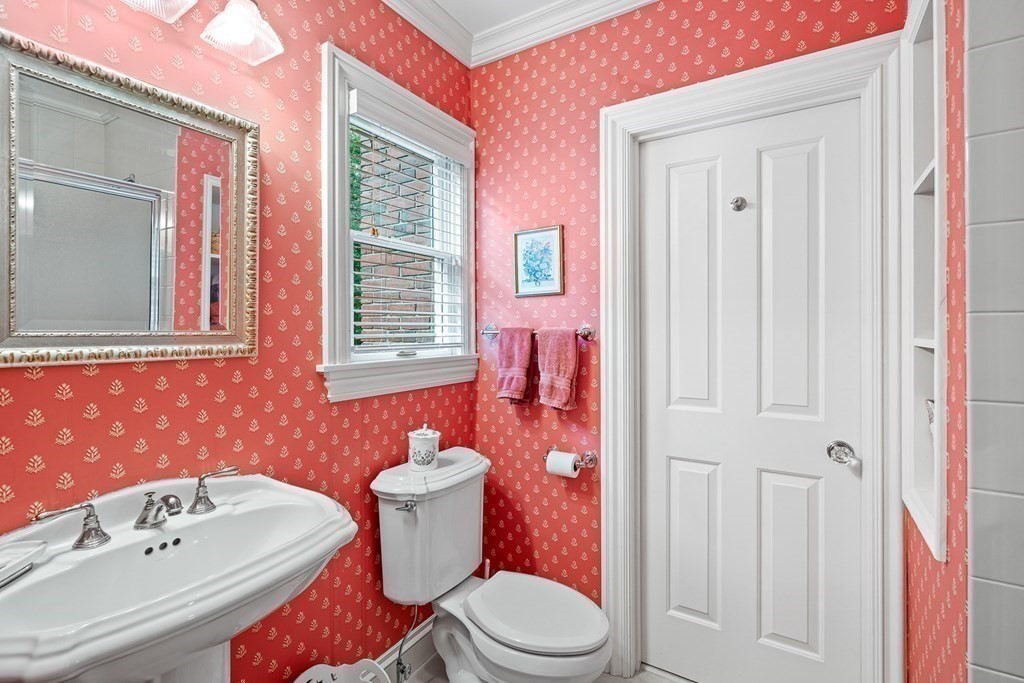 135 Washington Street Wellesley, MA 02481 - Photo 23 of 39 a bathroom with a sink a toilet a mirror and shower