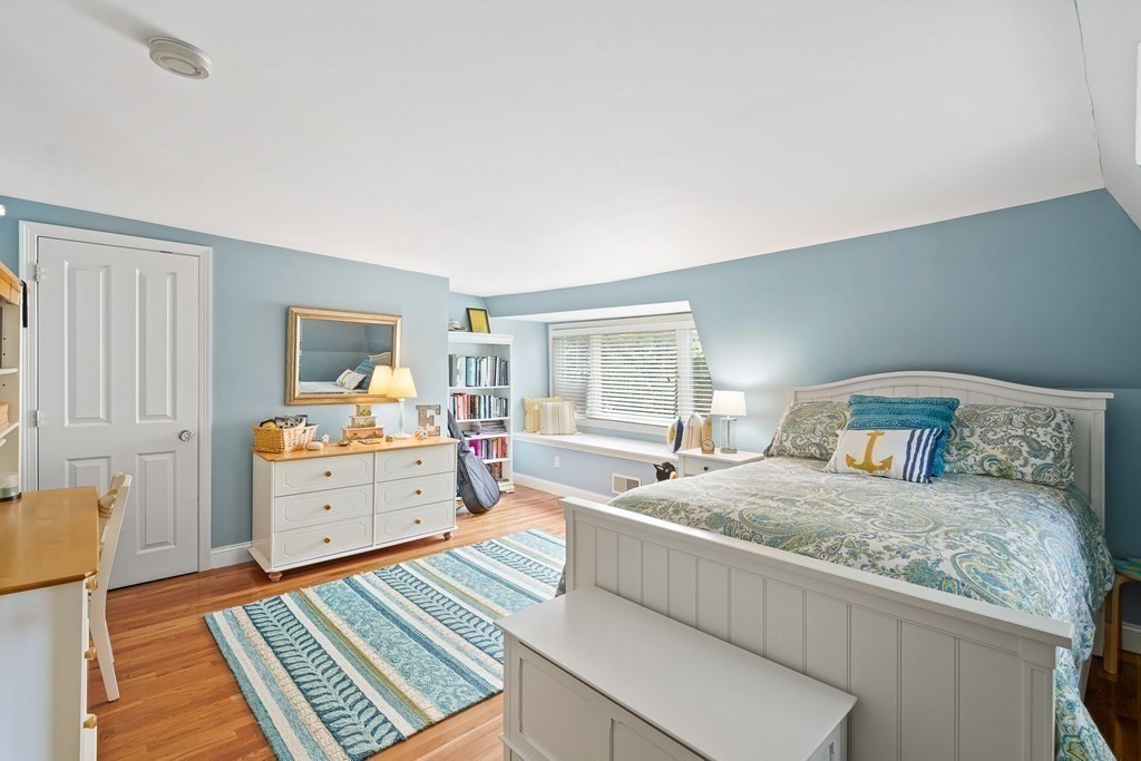135 Washington Street Wellesley, MA 02481 - Photo 25 of 39 a bedroom with a bed and wooden floor