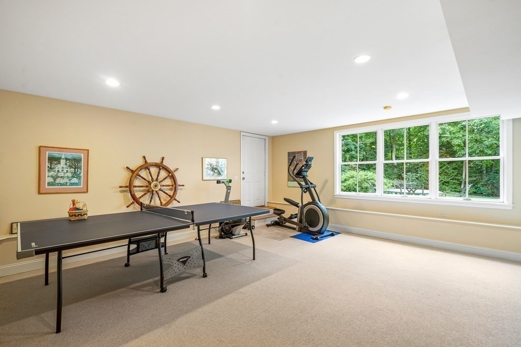 135 Washington Street Wellesley, MA 02481 - Photo 28 of 39 a living room with furniture a floor to ceiling window and a large window