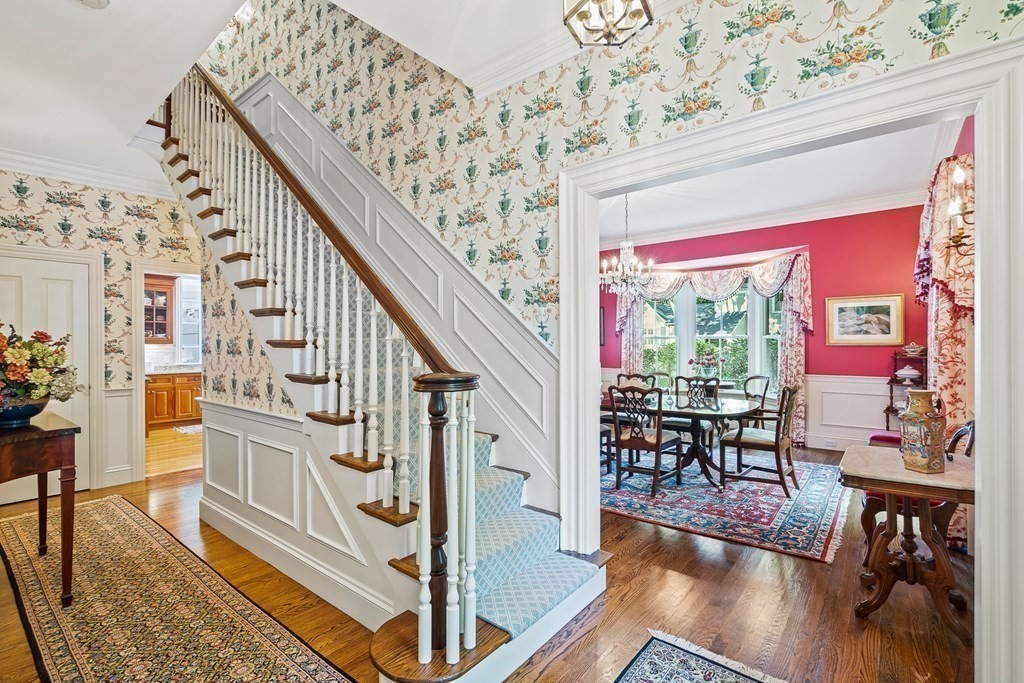 135 Washington Street Wellesley, MA 02481 - Photo 4 of 39 a view of an entryway with wooden floor and furniture