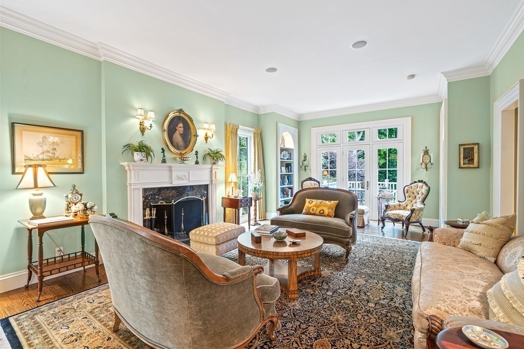 135 Washington Street Wellesley, MA 02481 - Photo 5 of 39 a living room with fireplace furniture and a large window
