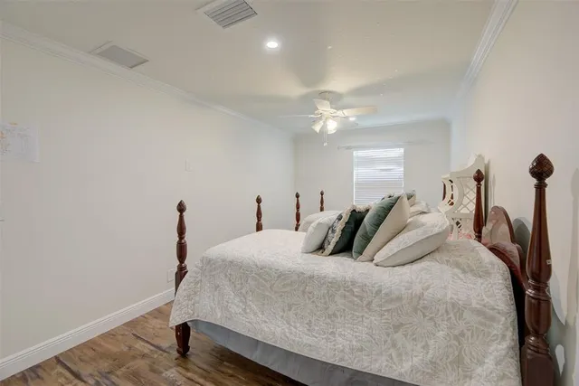 a bedroom with a large bed and a couch