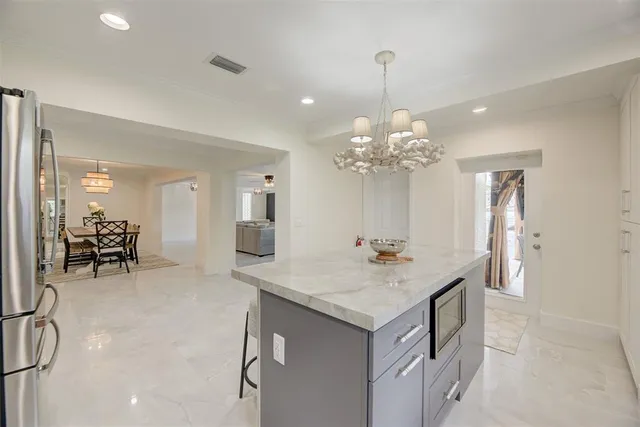 a bathroom with a sink vanity and a mirror