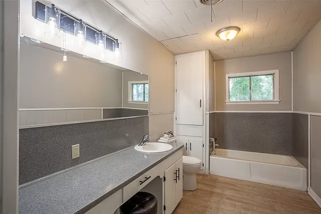 an empty room with wooden floor