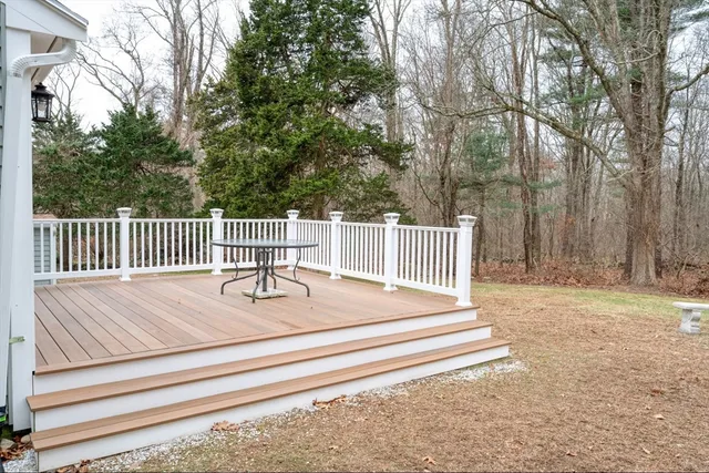 a view of backyard and deck