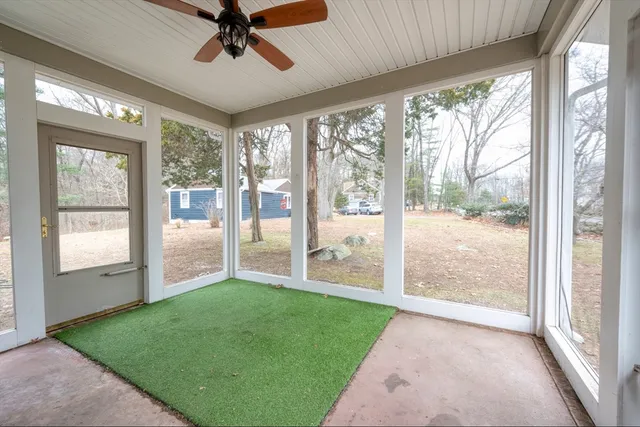 a view of a big room with windows