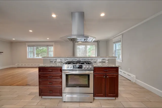 a kitchen with a stove and a sink