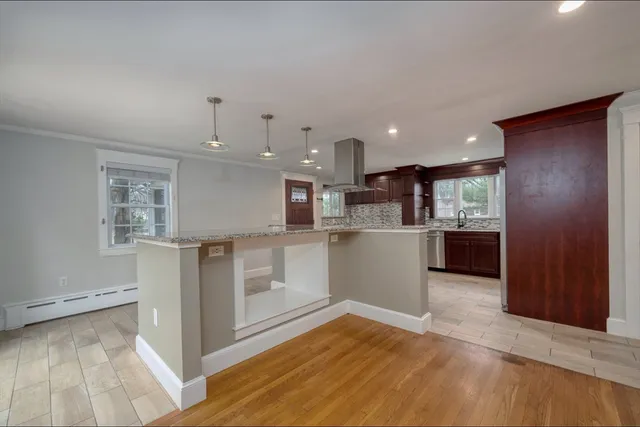 a view of kitchen with wooden floor