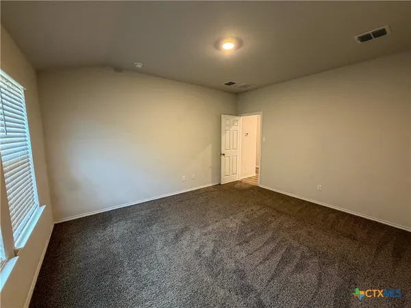 an empty room with a natural light