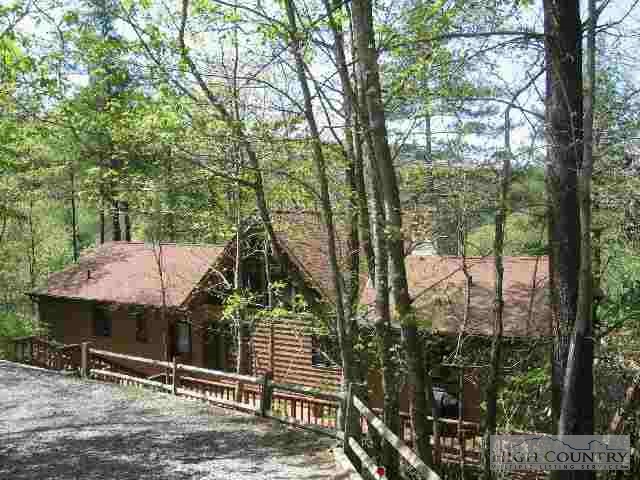 136 High Hollow Road Deep Gap, NC 28618 - Photo 1 of 1 a view of a house with backyard and sitting area