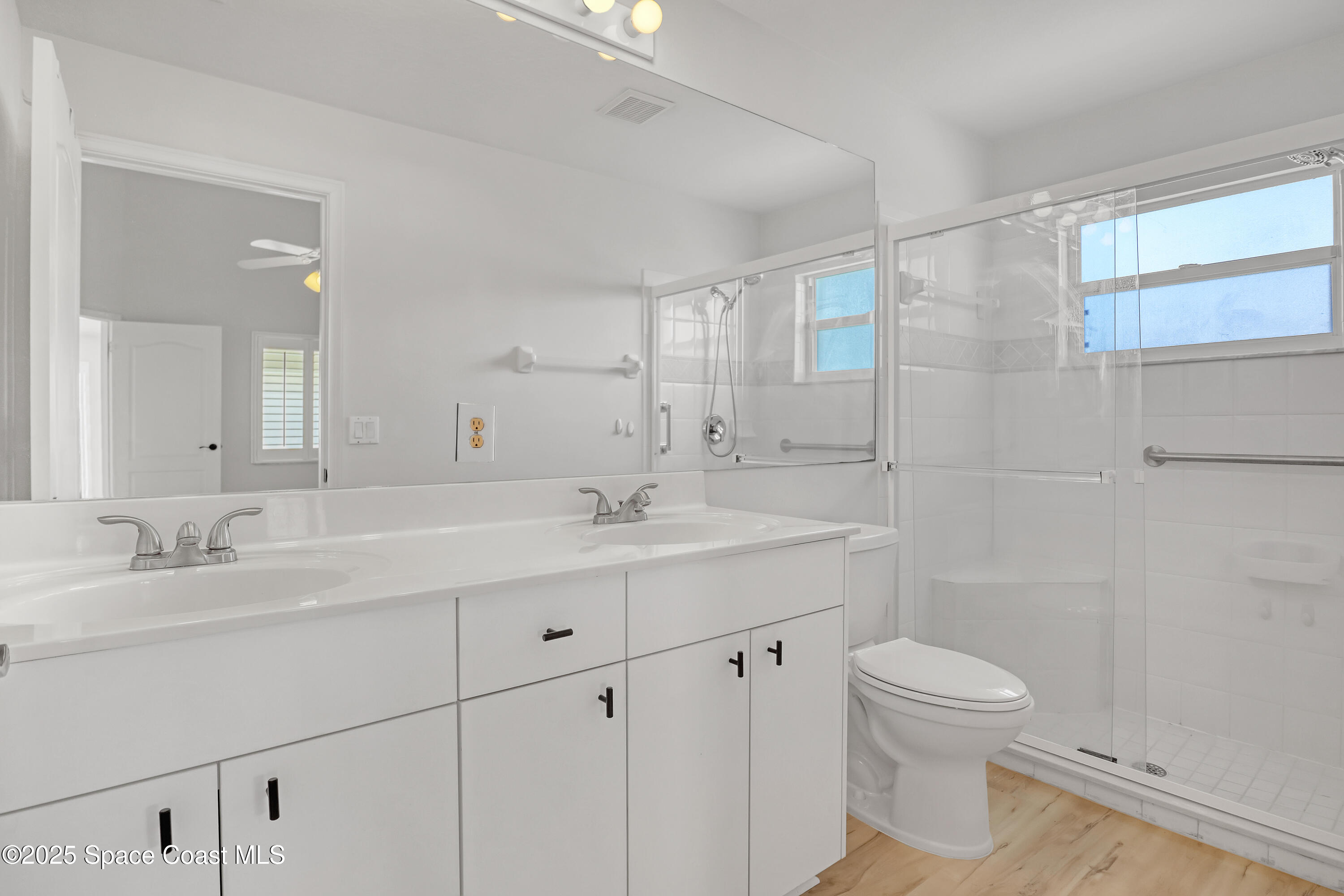 1692 Keys Gate Drive Melbourne, FL 32940 - Photo 22 of 26 a bathroom with a sink toilet and shower