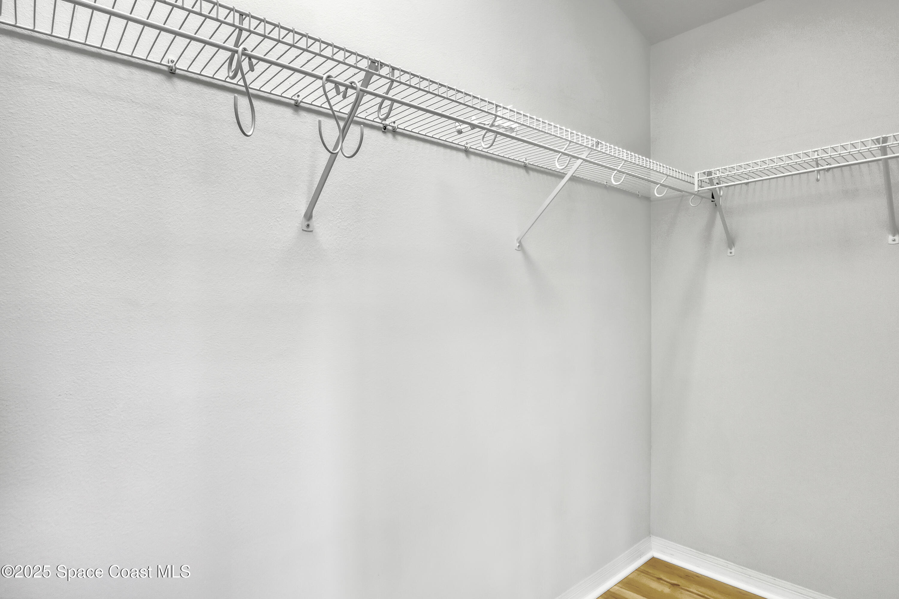 1692 Keys Gate Drive Melbourne, FL 32940 - Photo 23 of 26 a view of a room with racks on the wall