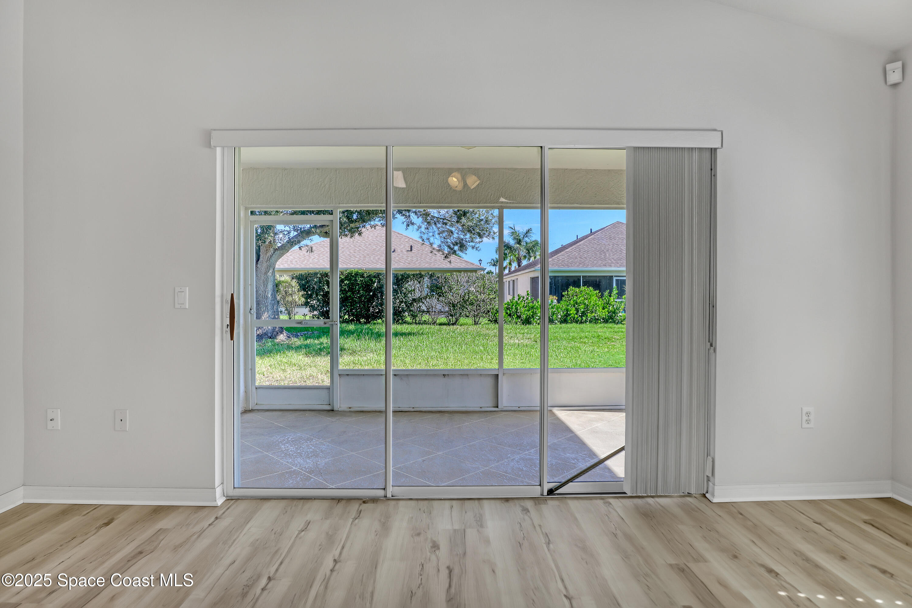 1692 Keys Gate Drive Melbourne, FL 32940 - Photo 4 of 26 a view of a room with wooden floor and iron gate