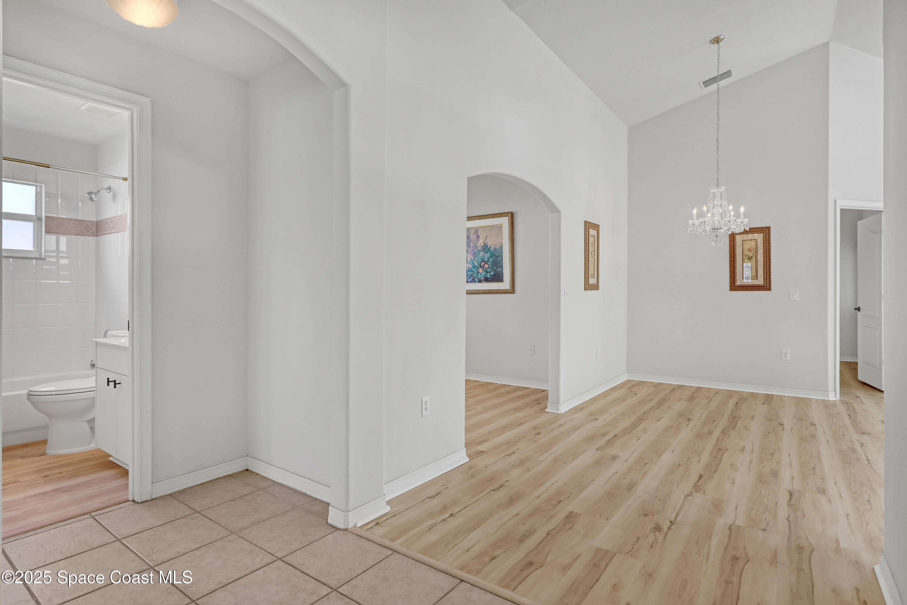 1692 Keys Gate Drive Melbourne, FL 32940 - Photo 8 of 26 a view of a room with wooden floor and a toilet