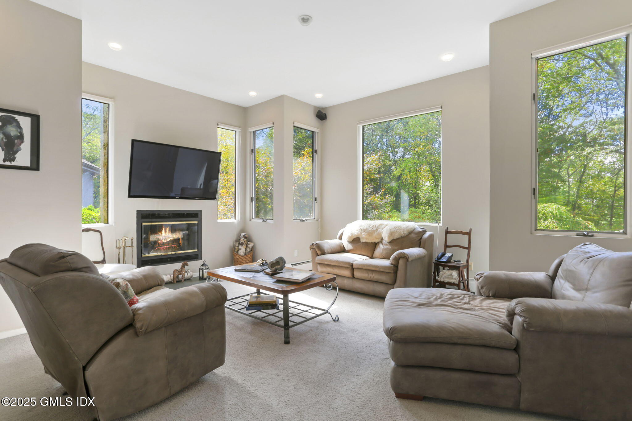 43 Sterling Road South Greenwich, CT 06831 - Photo 19 of 45 a living room with furniture a flat screen tv and a fireplace