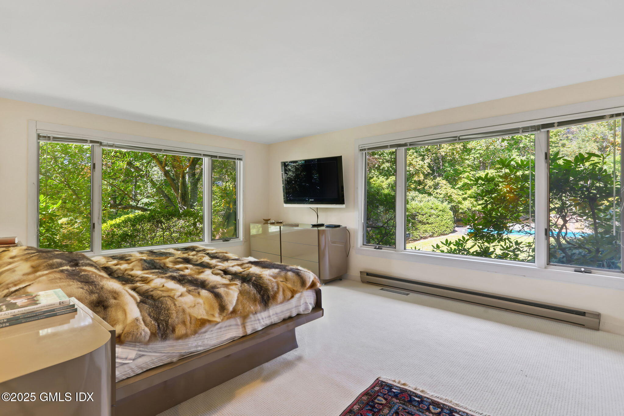 43 Sterling Road South Greenwich, CT 06831 - Photo 21 of 45 a bedroom with a bed and large window