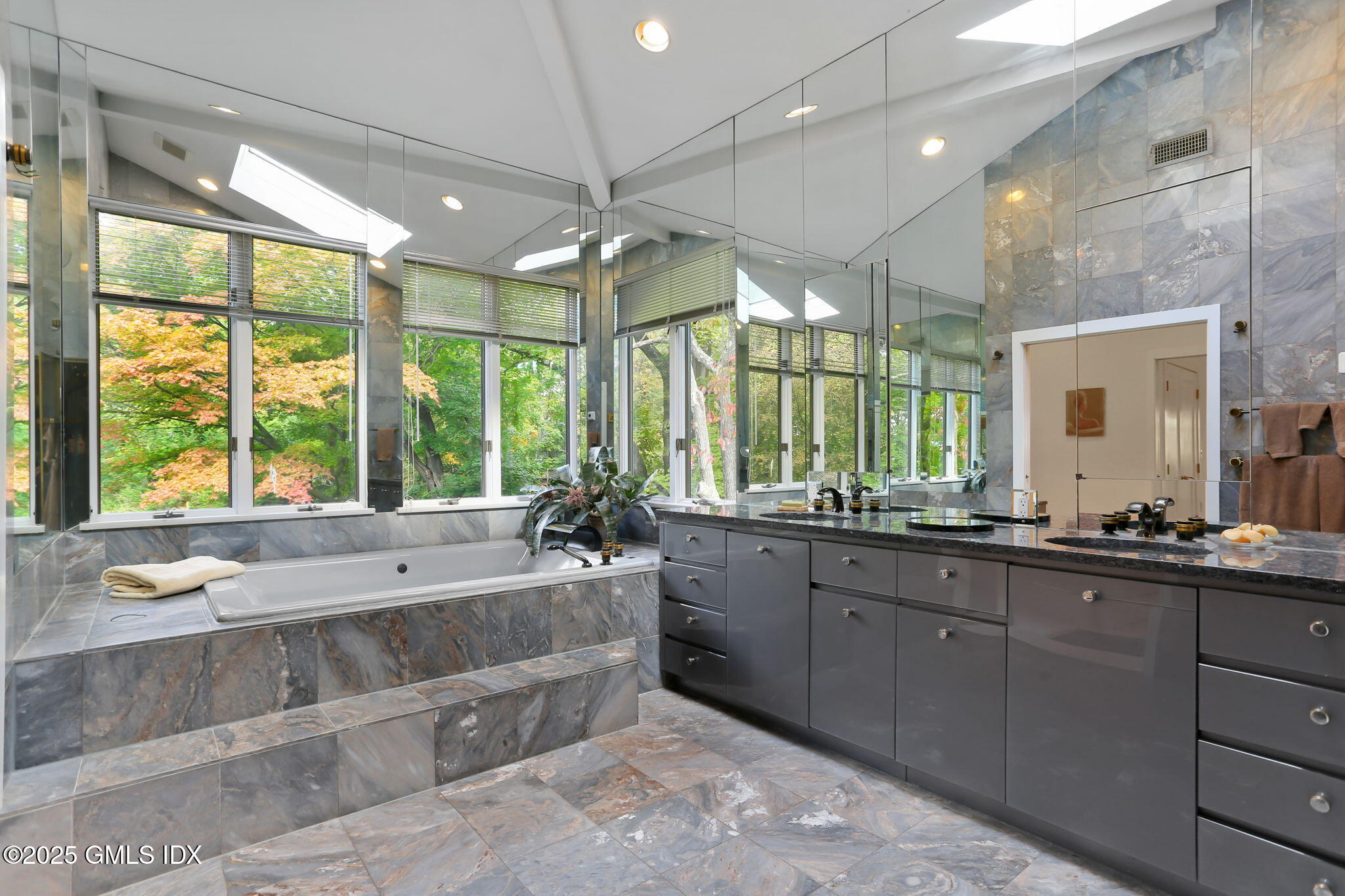 43 Sterling Road South Greenwich, CT 06831 - Photo 26 of 45 a large bathroom with a large tub and sink