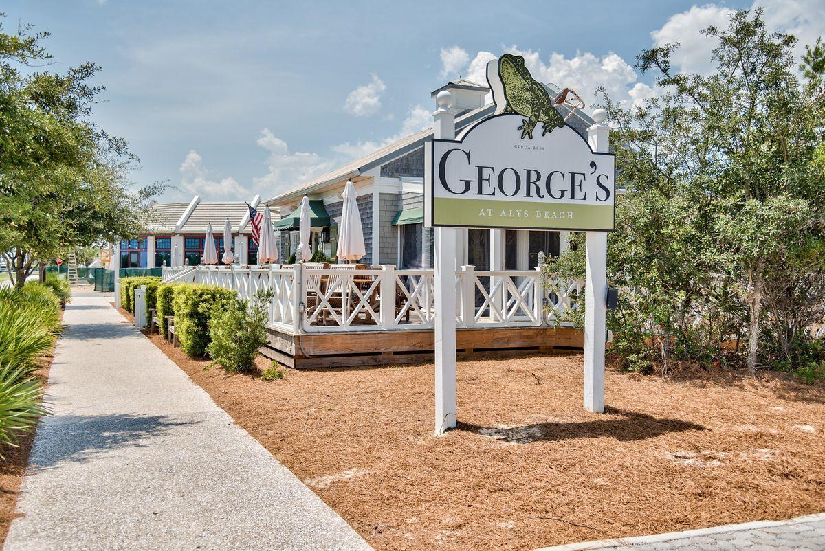 Lot 9 Beachcomber Ln Inlet Beach Inlet Beach, FL 32461 - Photo 20 of 20 a front view of a building with garden and retail shops