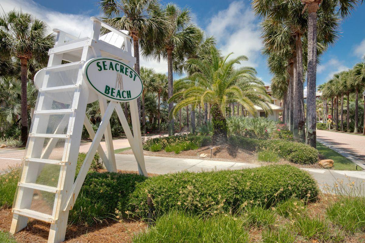 Lot 9 Beachcomber Ln Inlet Beach Inlet Beach, FL 32461 - Photo 8 of 20 a front view of multi story residential apartment building with yard and sign board