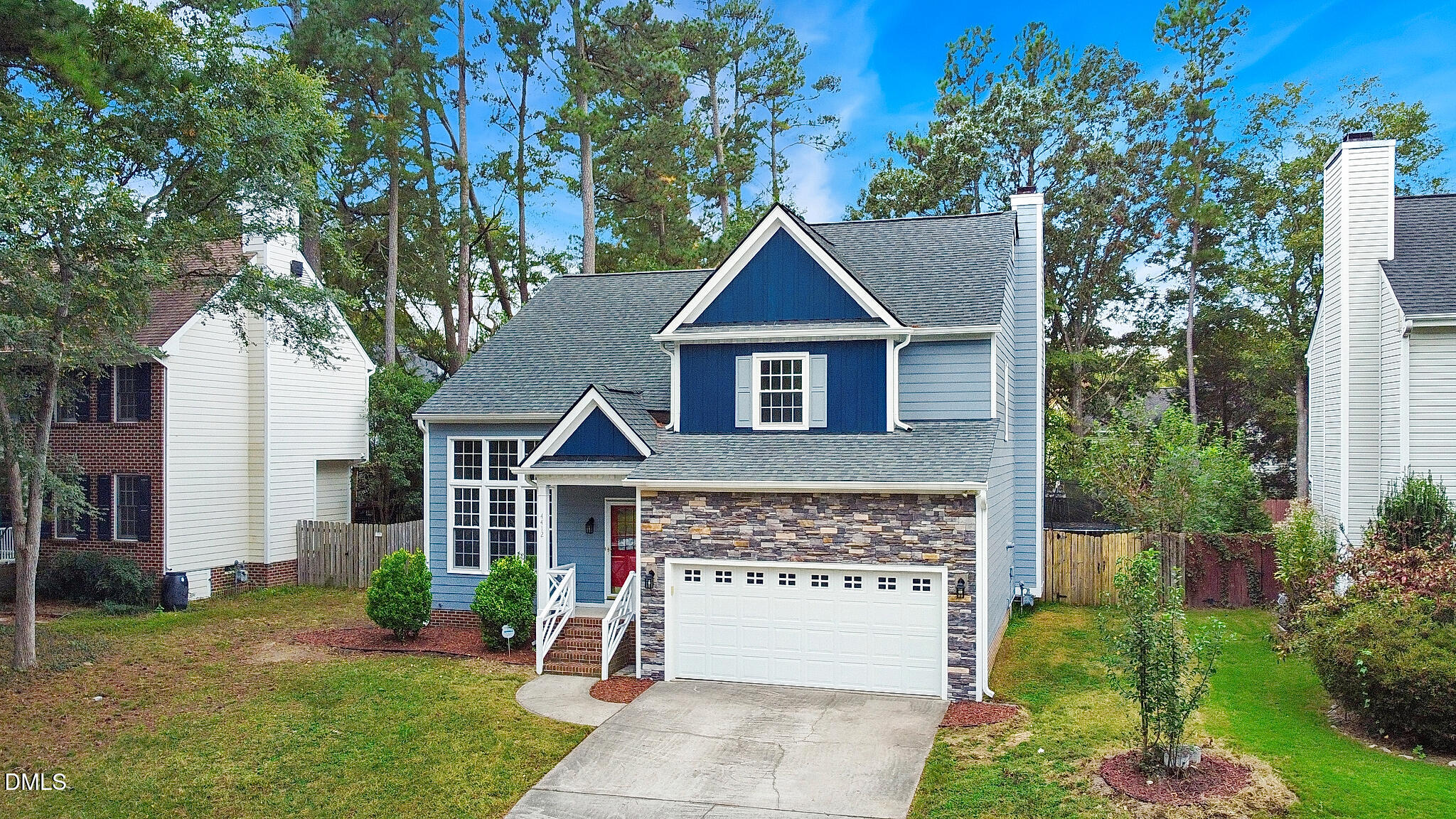 4412 Birmingham Way Raleigh, NC 27604 - Photo 2 of 41 a front view of a house with a garden and plants